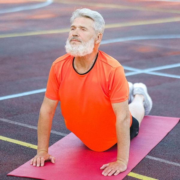 Person stretching outdoors, feeling energized and full of vitality.